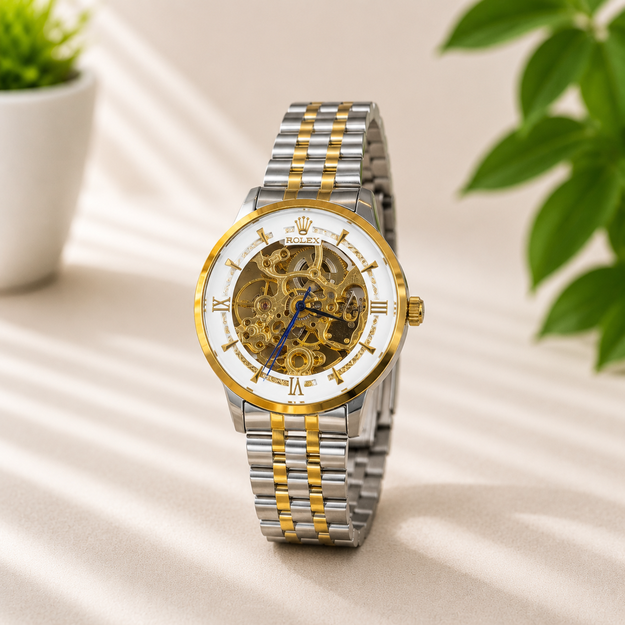 Luxury automatic skeleton two-tone stainless steel watch with white dial and Roman numerals.