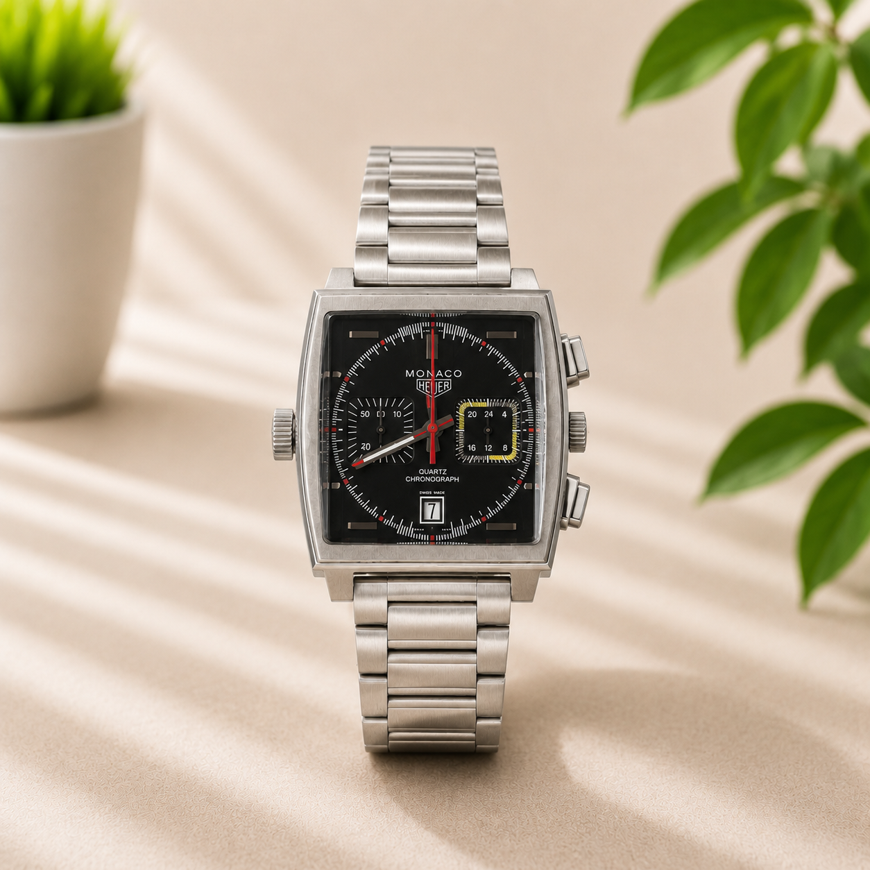 Luxury square chronograph stainless steel watch with black dial and silver bracelet for men.
