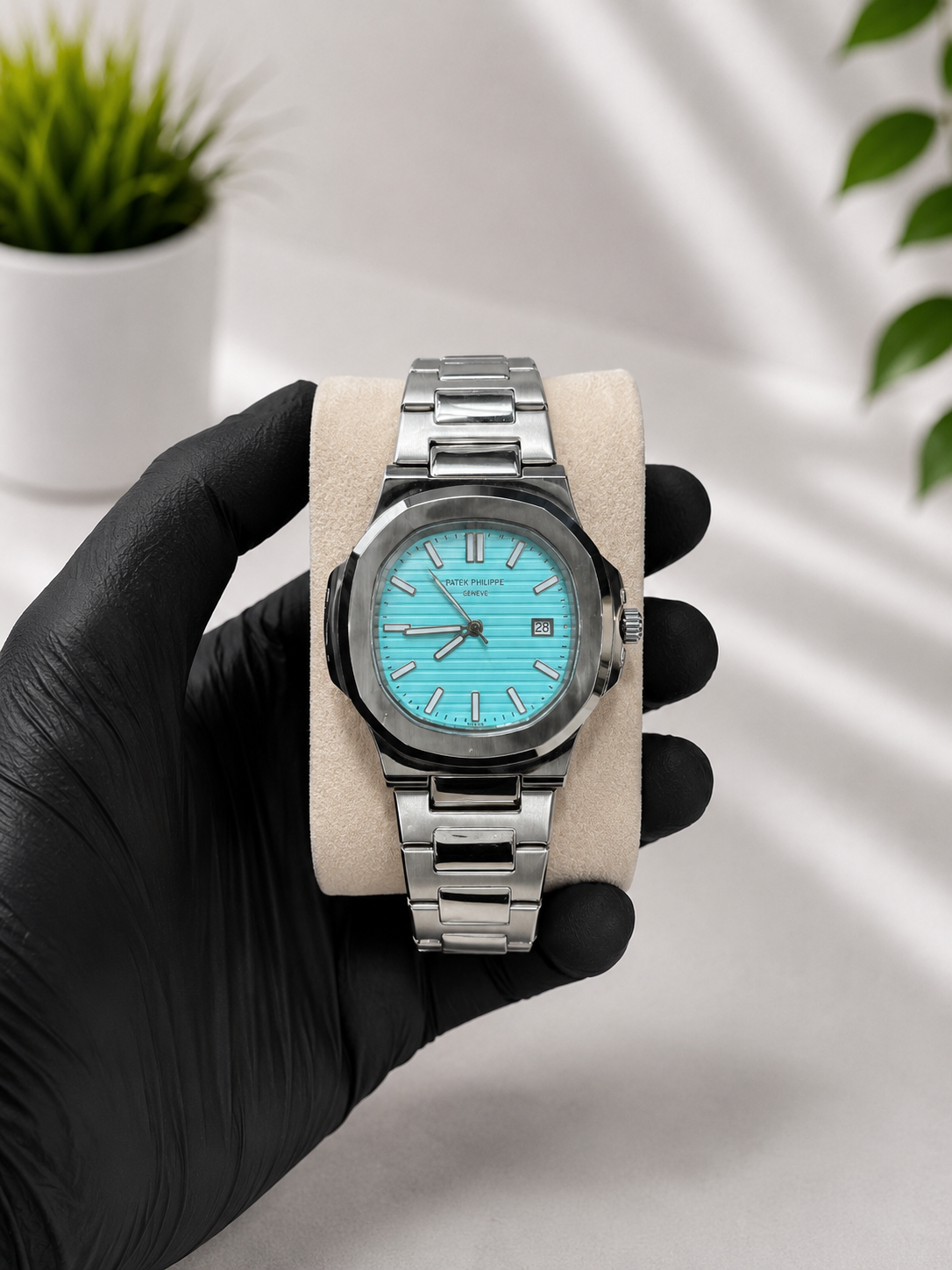 Luxury stainless steel men's watch with white and Tiffany blue dial, analog display and premium bracelet.