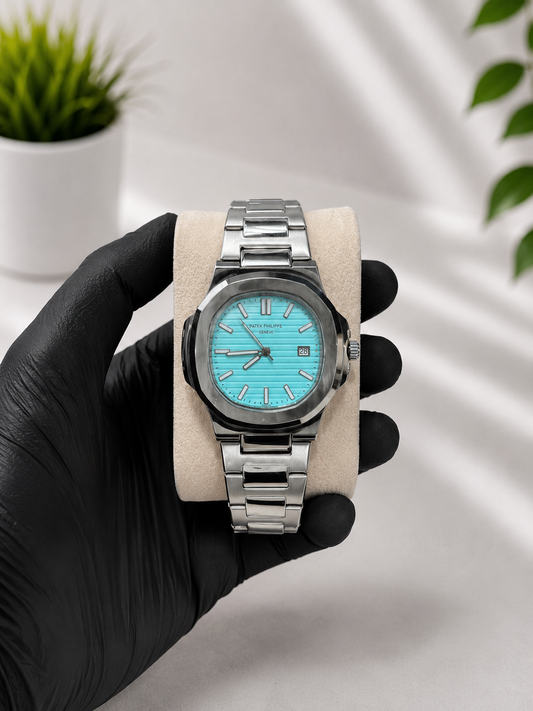 Luxury stainless steel men's watch with white and Tiffany blue dial, analog display and premium bracelet.